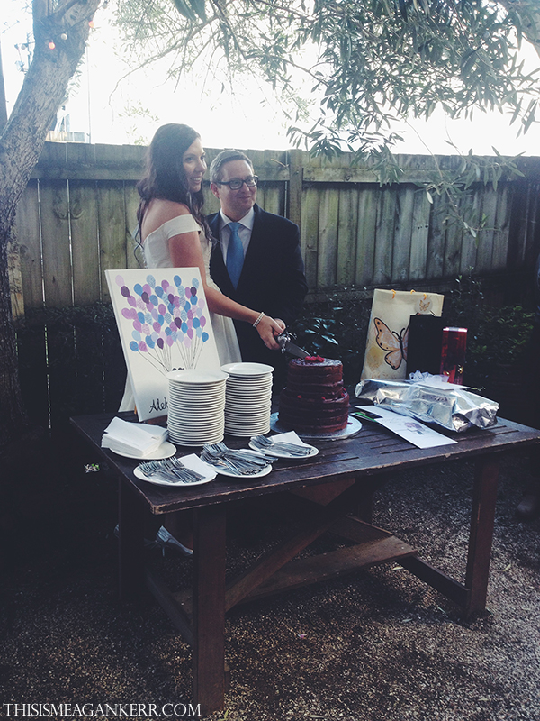 Penny and Aleks Lazic cutting their wedding cake