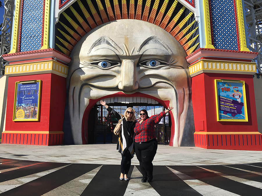 Style bloggers Meagan Kerr and Curvy Sam at the entrance to Luna Park in Melbourne, Australia