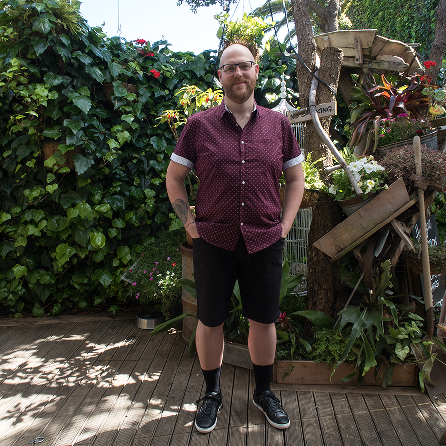 Big and tall menswear for parties: Doug Peters wears Marling Stretch Print Shirt, Steve Stretch Denim Shorts and Essential Trainers from Johnny Bigg at The Garden Shed