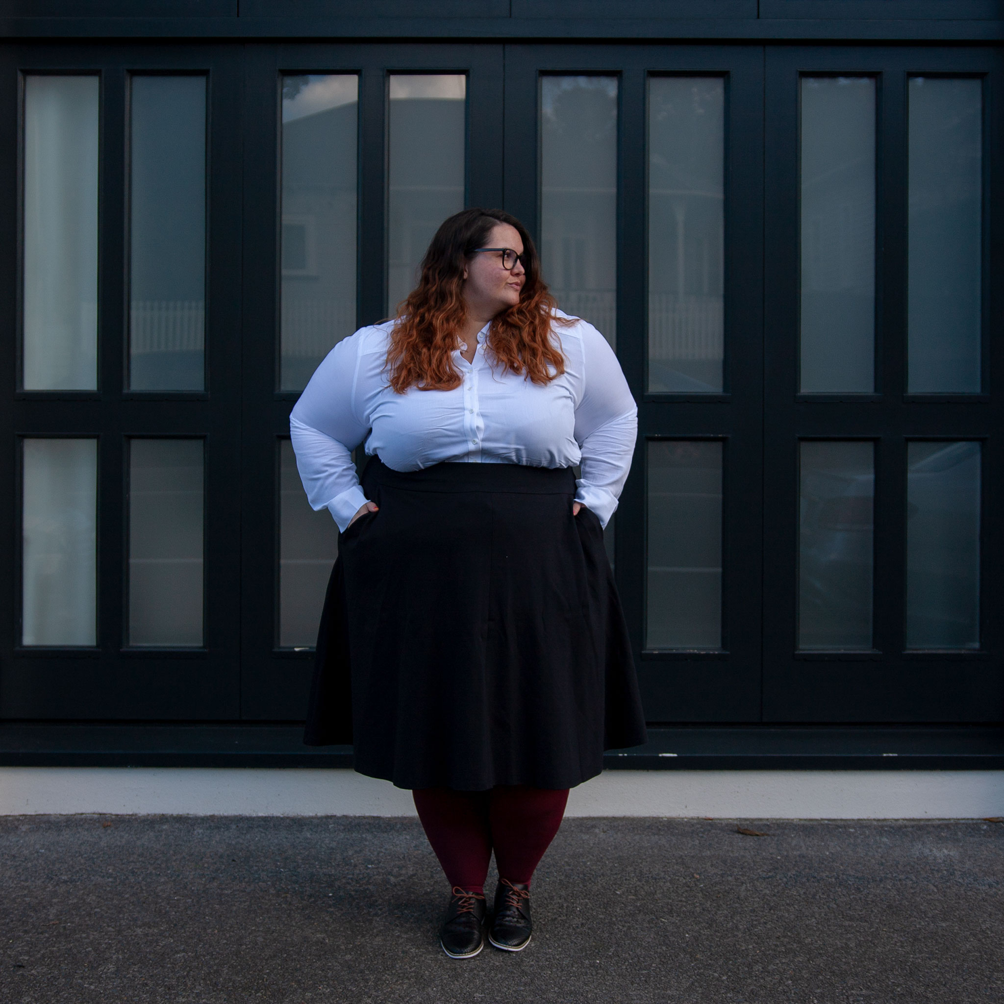 New Zealand plus size blogger Meagan Kerr wears 17 Sundays Basic Longline White Button Up Shirt, Lane Bryant Ponte Circle Skirt, Pamela Mann 90 Denier Maxi Opaque Plus Size Tights from The Tight Spot, Emerge Anaheim Cut-out Lace Up Court Flat from EziBuy, Alexa Glasses from Specsavers. Photo by Doug Peters / Ambient Light