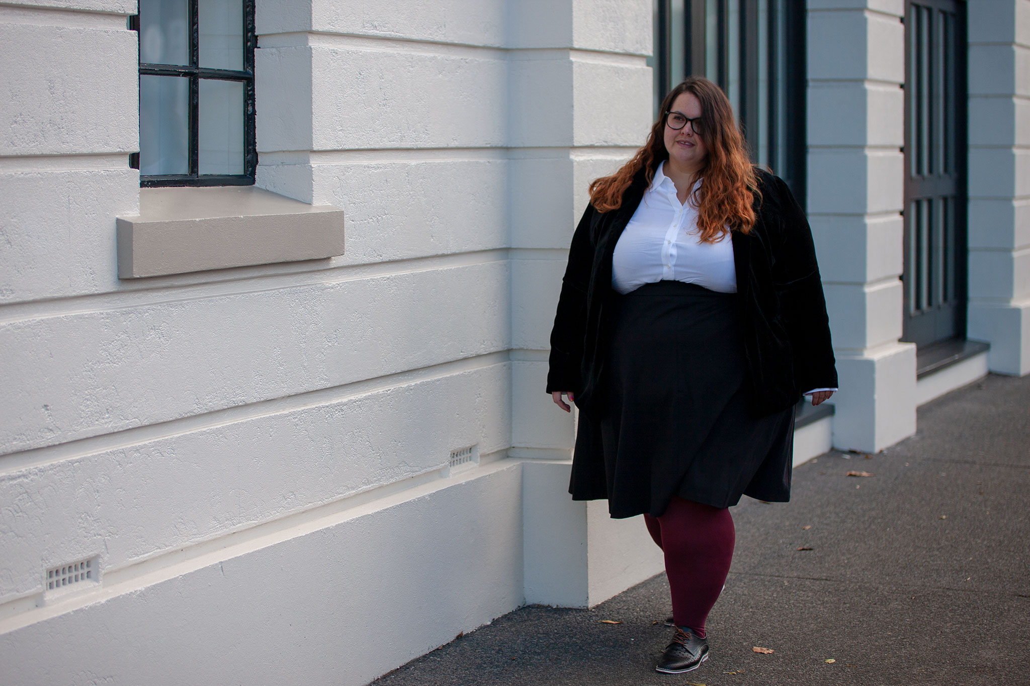 New Zealand plus size blogger Meagan Kerr wears 17 Sundays Basic Longline White Button Up Shirt, Lane Bryant Ponte Circle Skirt, Sara Velvet Blazer from Ezibuy, Pamela Mann 90 Denier Maxi Opaque Plus Size Tights from The Tight Spot, Emerge Anaheim Cut-out Lace Up Court Flat from Ezibuy, Alexa Glasses from Specsavers. Photo by Doug Peters / Ambient Light
