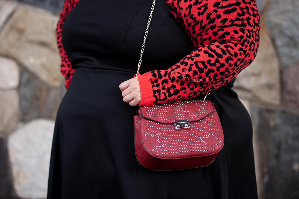 New Zealand plus size fashion blogger Meagan Kerr wears Oasis Curve Animal Jacquard Sweater, Ponte Pinafore, adidas Daily Qt Sneakers and Red Studded Saddle Bag from Simply Be