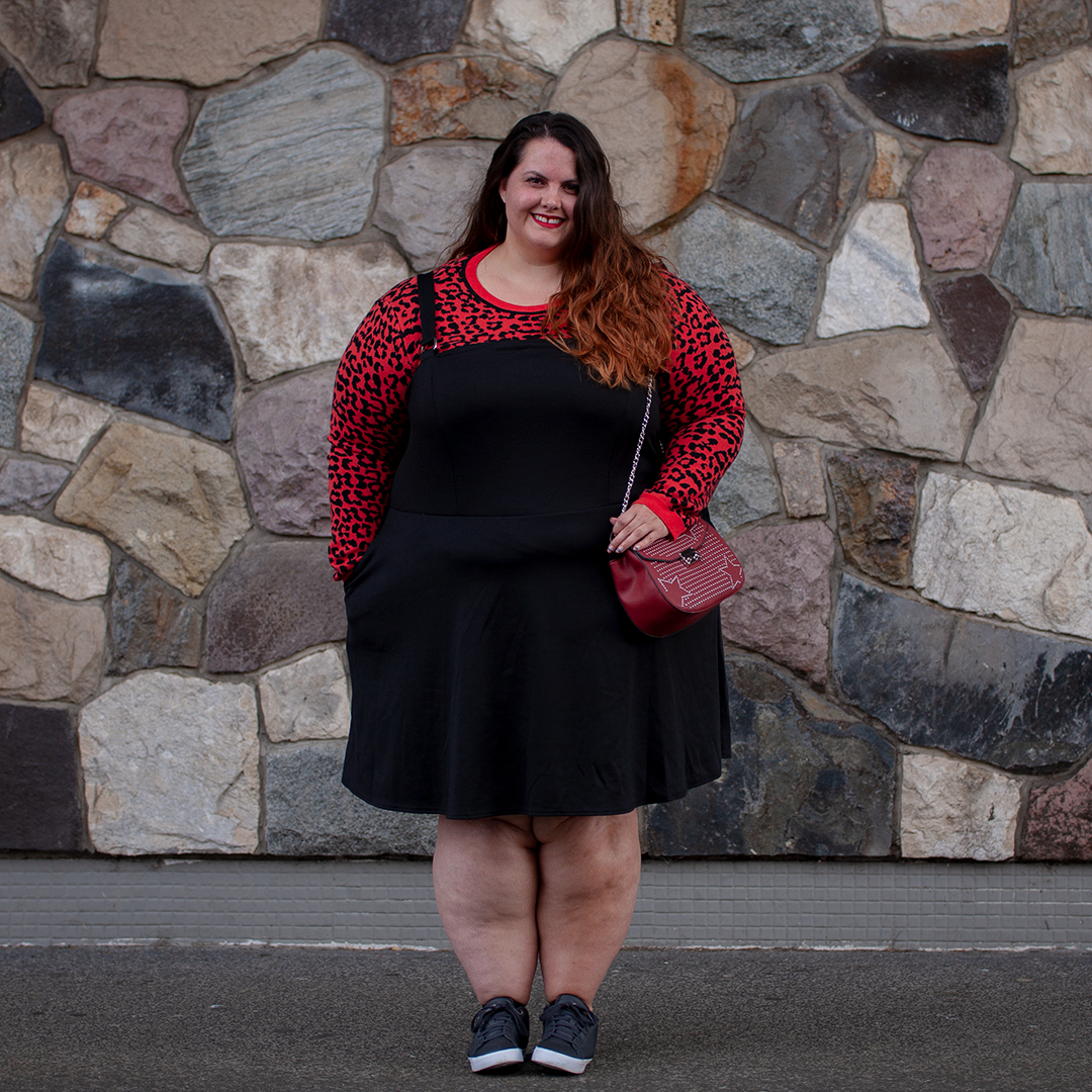 New Zealand plus size fashion blogger Meagan Kerr wears Oasis Curve Animal Jacquard Sweater, Ponte Pinafore, adidas Daily Qt Sneakers and Red Studded Saddle Bag from Simply Be