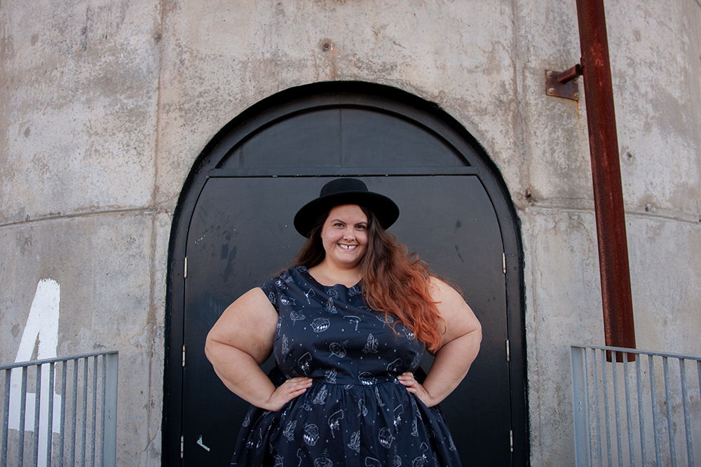 Kind of magic: New Zealand plus size fashion blogger Meagan Kerr wears Li'l Miss Meanie Dress by Cutting Shapes Club, Lida Seamless Plus Size Leggings from The Tight Spot, Limited Edition Lecester Boots from Number One Shoes and ASOS DESIGN Wide Brim Pork Pie Hat from ASOS