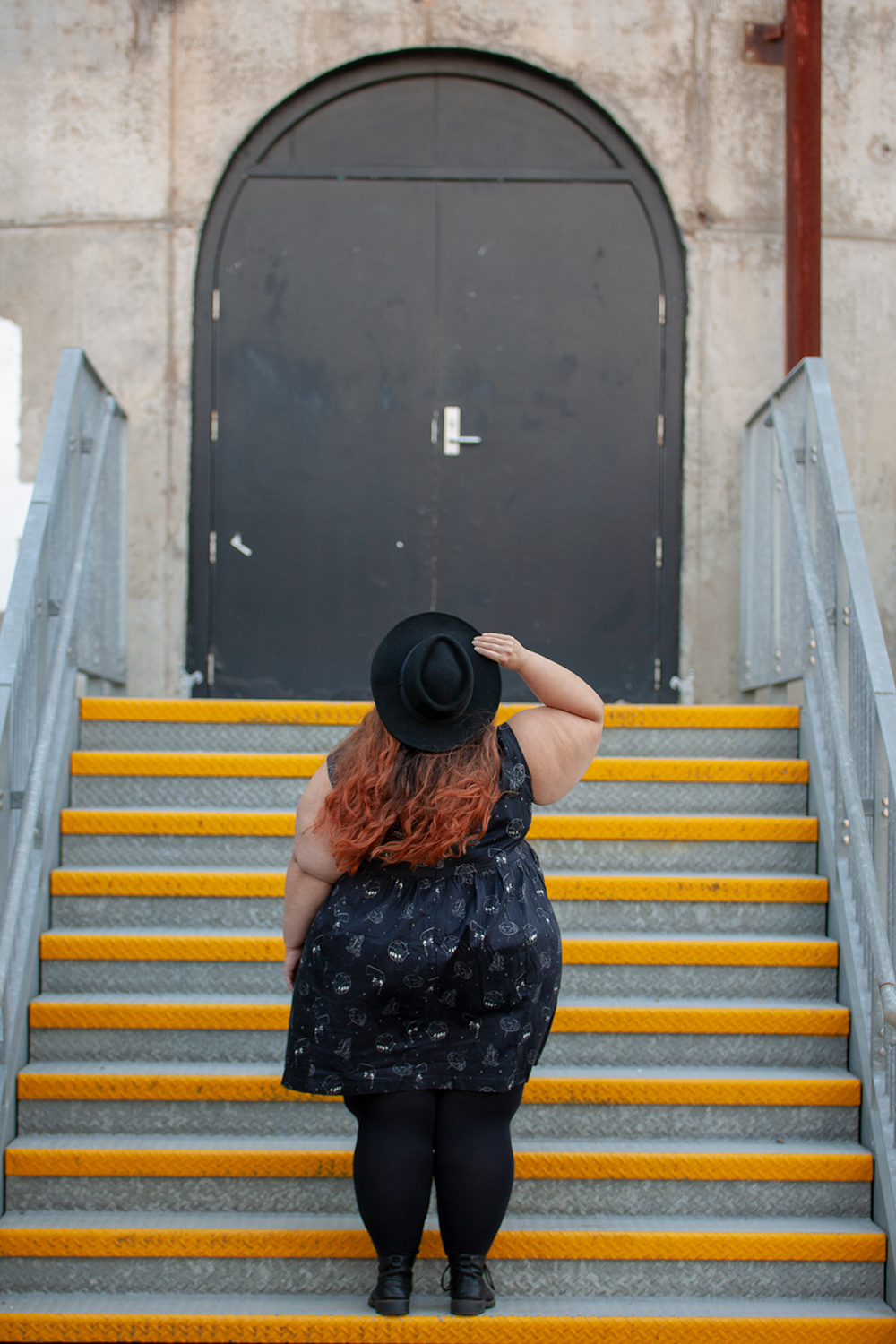 Kind of magic: New Zealand plus size fashion blogger Meagan Kerr wears Li'l Miss Meanie Dress by Cutting Shapes Club, Lida Seamless Plus Size Leggings from The Tight Spot, Limited Edition Lecester Boots from Number One Shoes and ASOS DESIGN Wide Brim Pork Pie Hat from ASOS