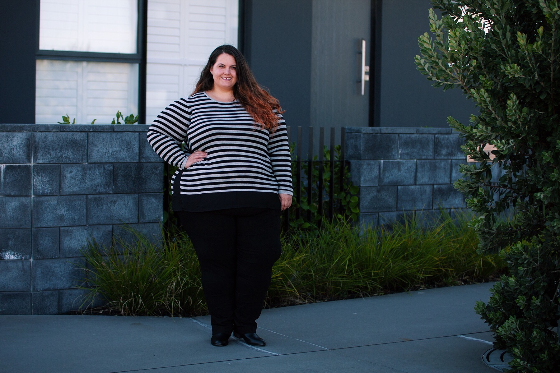 Plus size fashion blogger Meagan Kerr wears Stripe Curved Hem Top, Super Stretch Pants and Ankle Boots from Autograph