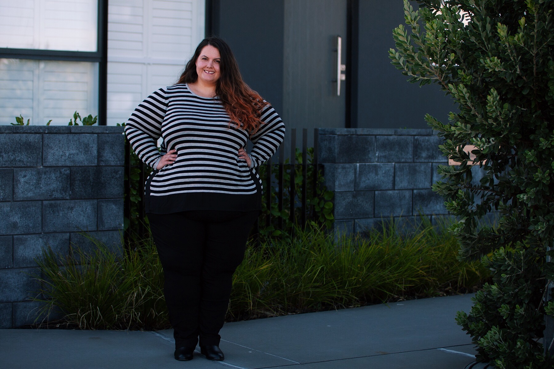 Plus size fashion blogger Meagan Kerr wears Stripe Curved Hem Top, Super Stretch Pants and Ankle Boots from Autograph