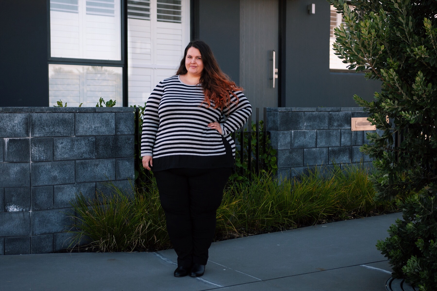 Plus size fashion blogger Meagan Kerr wears Stripe Curved Hem Top, Super Stretch Pants and Ankle Boots from Autograph