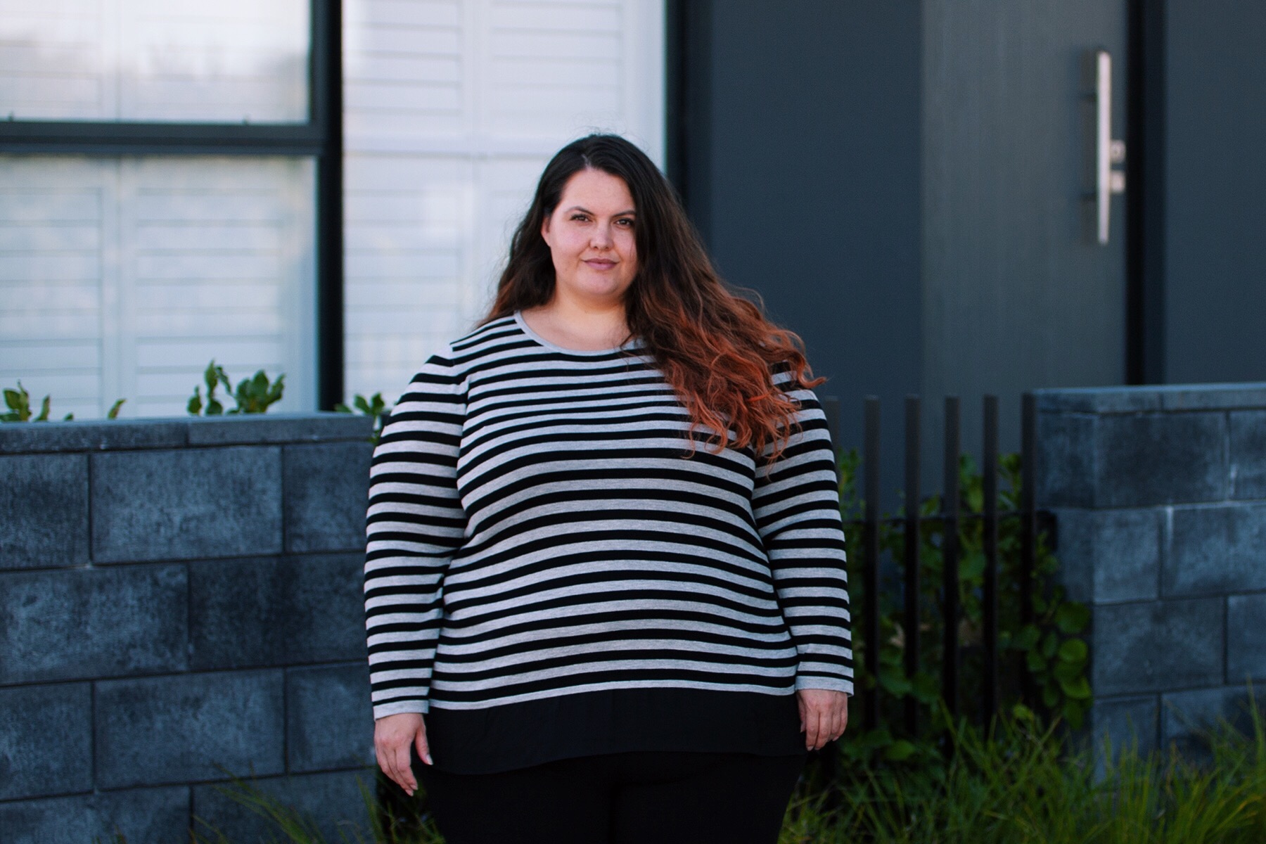 Plus size fashion blogger Meagan Kerr wears Stripe Curved Hem Top, Super Stretch Pants and Ankle Boots from Autograph