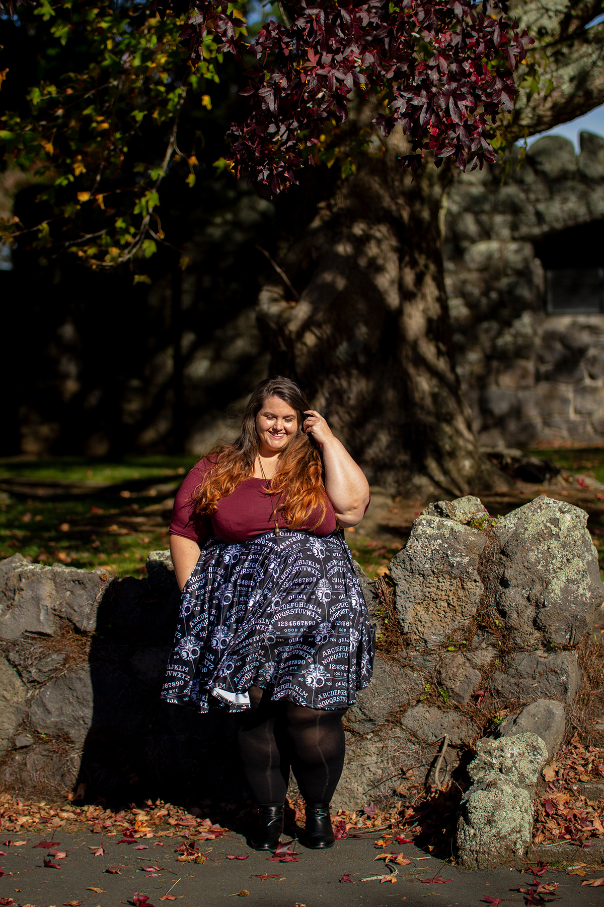 New Zealand plus size blogger Meagan Kerr wears v-neck tunic from Torrid, ouija print skirt from Joolz Fashion, stockings from Snag Tights, boots from Autograph Fashion and skull necklace from Luke Adore Jewellery