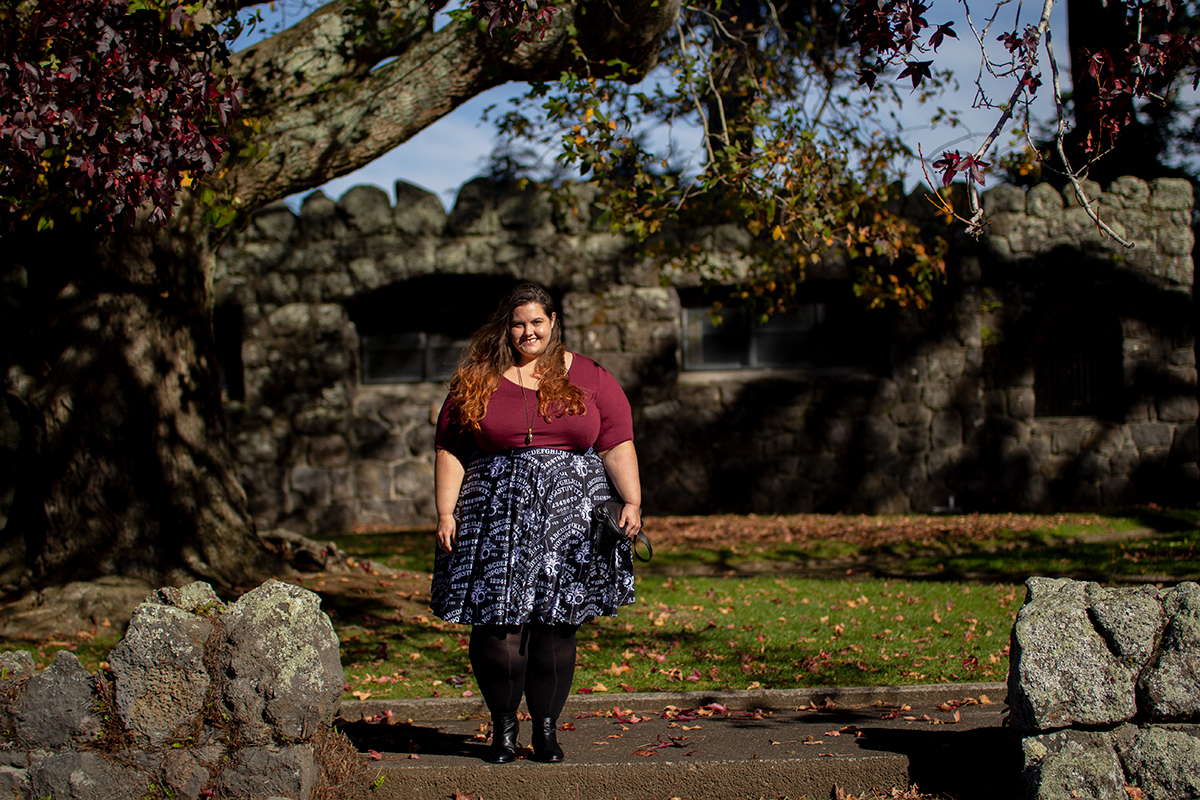 New Zealand plus size blogger Meagan Kerr wears v-neck tunic from Torrid, ouija print skirt from Joolz Fashion, stockings from Snag Tights, boots from Autograph Fashion and skull necklace from Luke Adore Jewellery