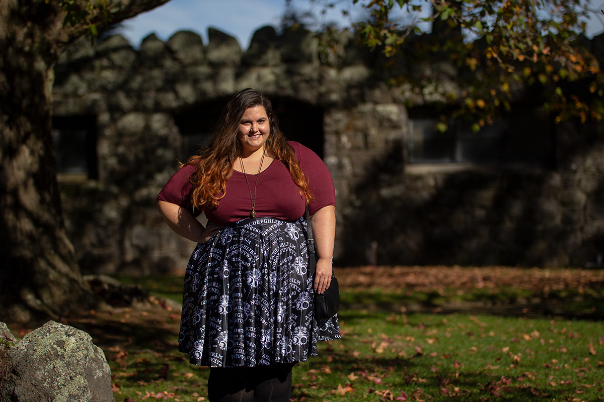 New Zealand plus size blogger Meagan Kerr wears v-neck tunic from Torrid, ouija print skirt from Joolz Fashion, stockings from Snag Tights, boots from Autograph Fashion and skull necklace from Luke Adore Jewellery