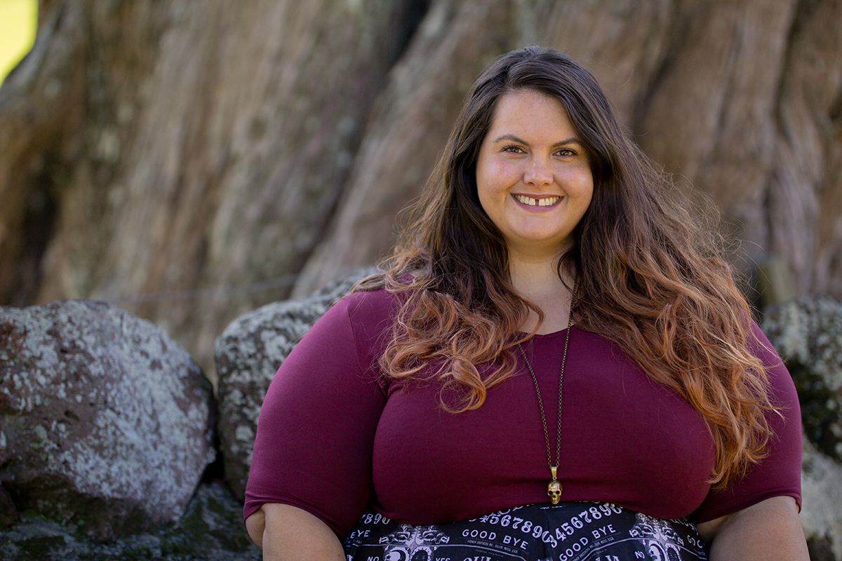 New Zealand plus size blogger Meagan Kerr wears v-neck tunic from Torrid, ouija print skirt from Joolz Fashion, stockings from Snag Tights, boots from Autograph Fashion and skull necklace from Luke Adore Jewellery