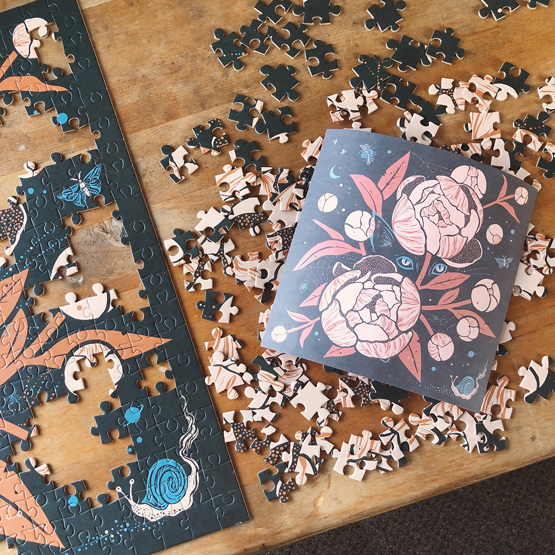A partially done jigsaw puzzle with loose pieces scattered on a wooden table