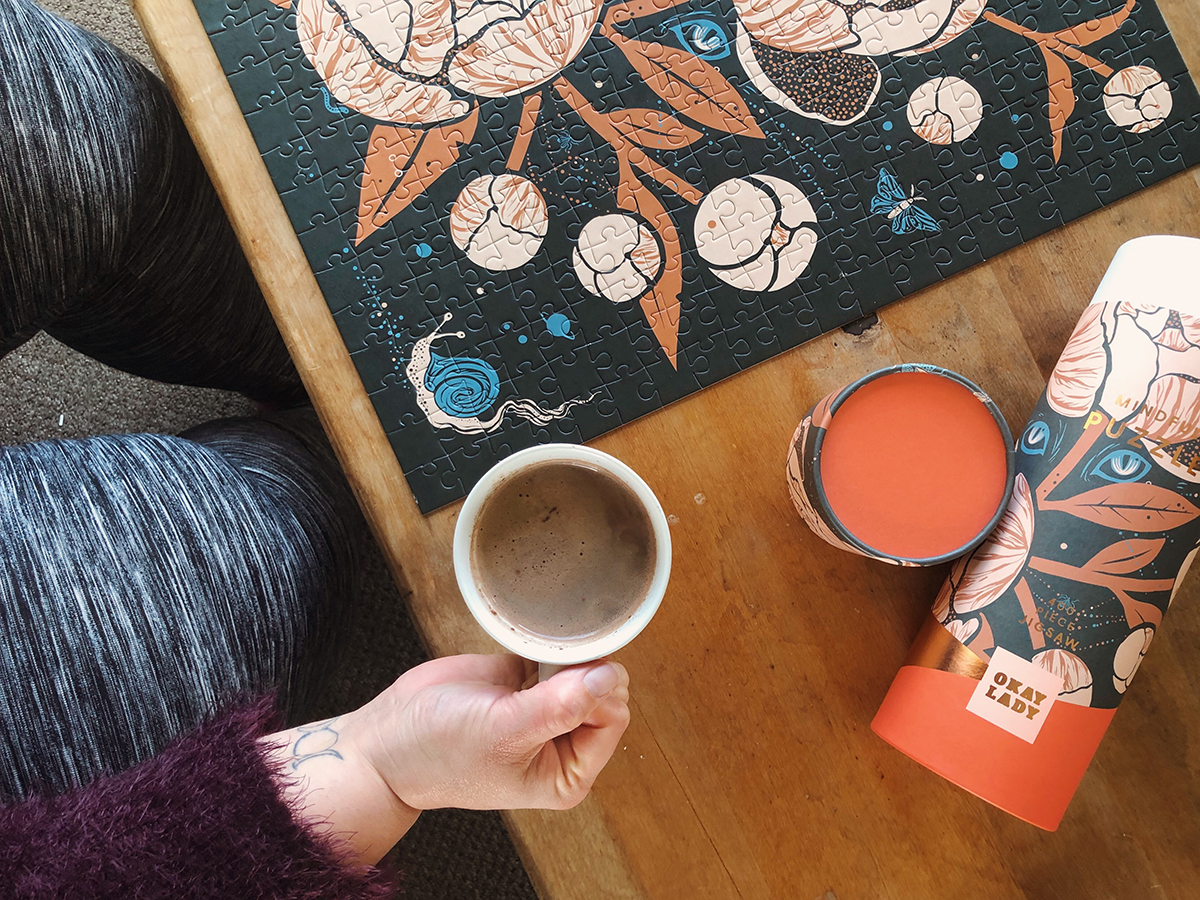 Meagan tries to relax with a cup of coffee and a mindful jigsaw puzzle