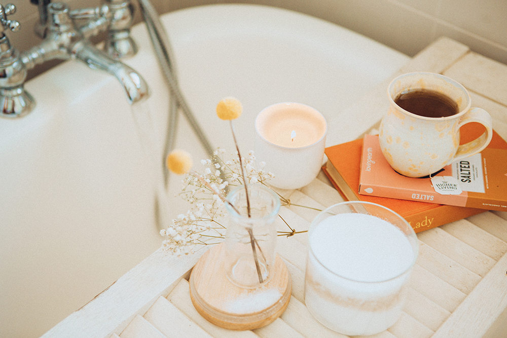 Ways to relax: a bath, a cup of tea and a good book. Photo by Maddi Bazzocco on Unsplash