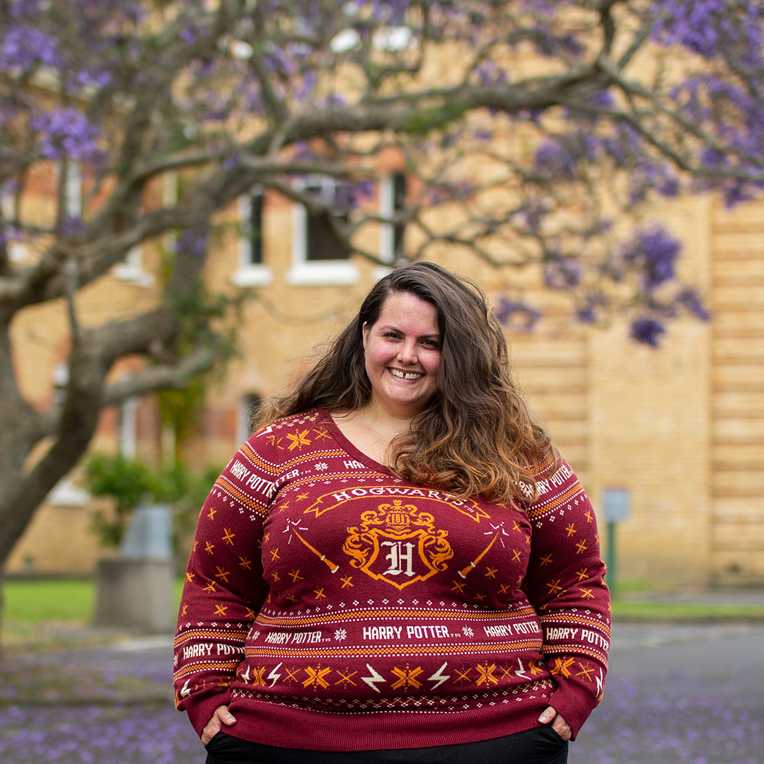New Zealand plus size fashion blogger Meagan Kerr wears Harry Potter Hogwarts Crest Dark Red Holiday Sweater from Torrid