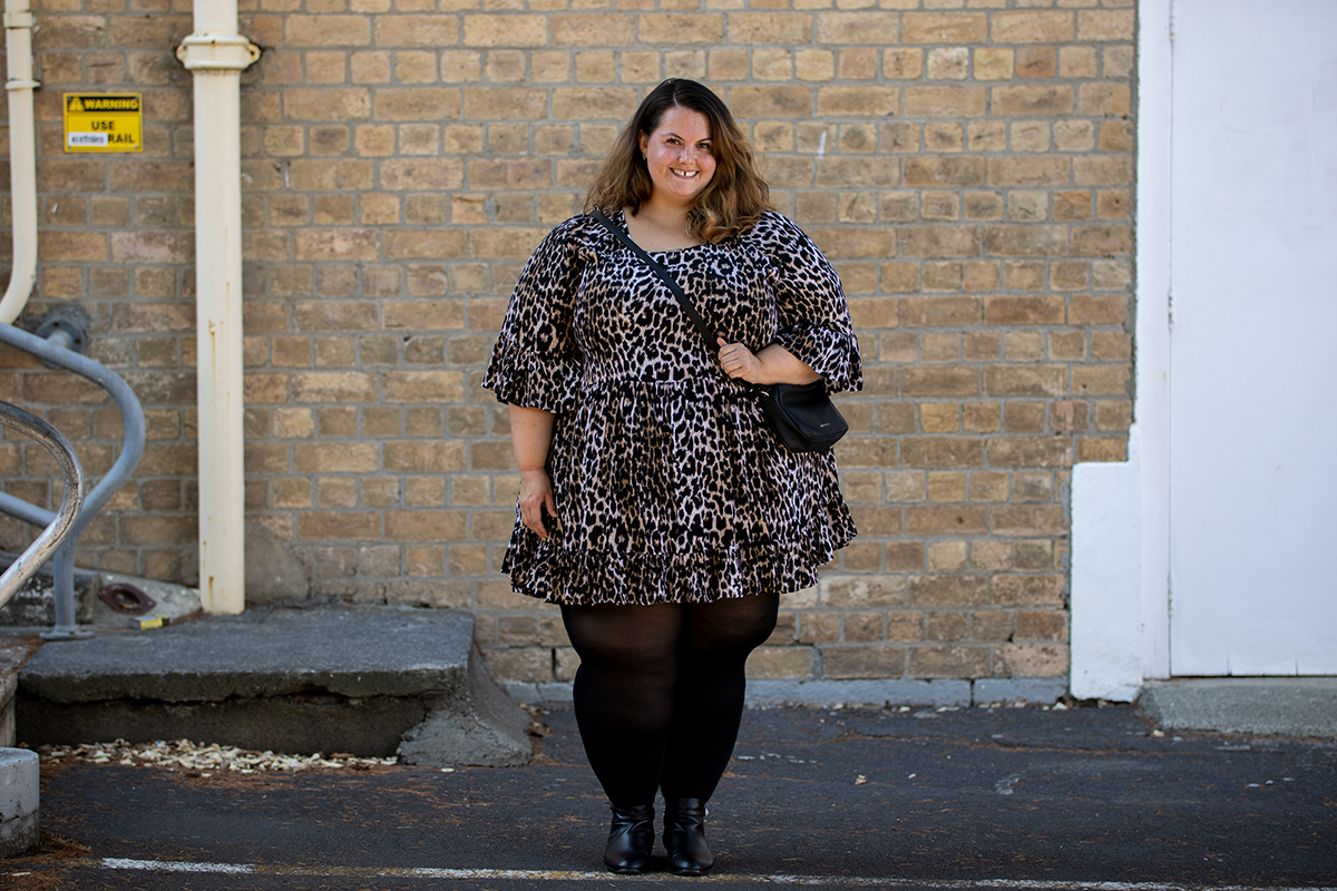 New Zealand plus size blogger Meagan Kerr wears Isla-Maree Evie Dress in Jungle, Snag Tights, Autograph Ankle Boots and Winona Crossbody Bag by Velvet Heartbeat