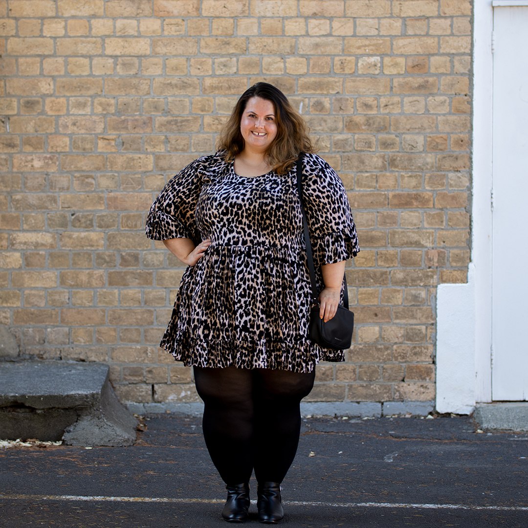 New Zealand plus size blogger Meagan Kerr wears Isla-Maree Evie Dress in Jungle, Snag Tights, Autograph Ankle Boots and Winona Crossbody Bag by Velvet Heartbeat