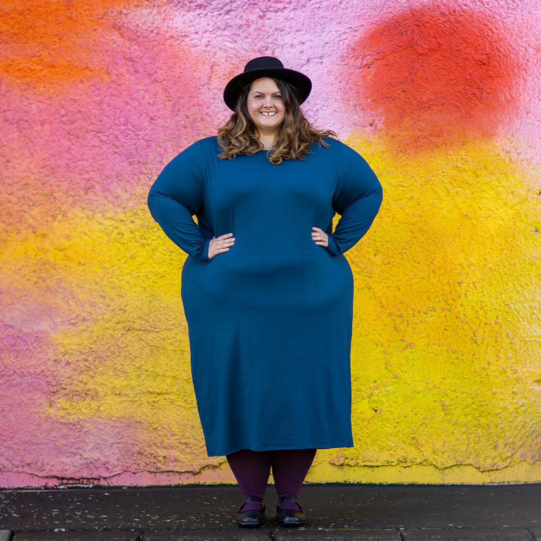 New Zealand plus size fashion blogger Meagan Kerr wears Ruby & Rain Rose Dress, ASOS Design Pork Pie Hat, Snag Tights in Plum and ABBY Mary-Janes from Ziera