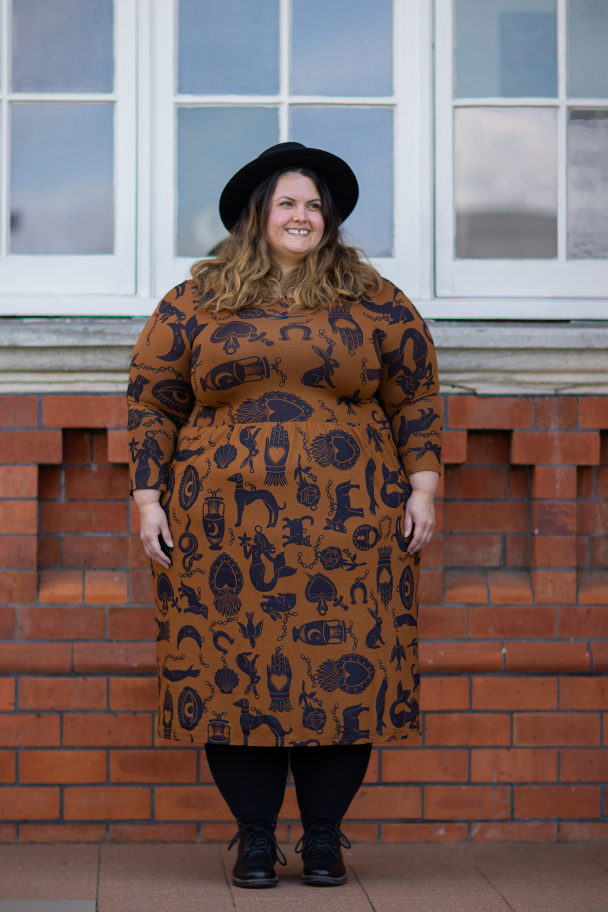 New Zealand plus size fashion blogger Meagan Kerr wears Made590 Sweeney Dress in Charmed, Snag Tights in black, ASOS DESIGN Pork Pie Hat from ASOS and Limited Edition Lecester Boots from Number One Shoes