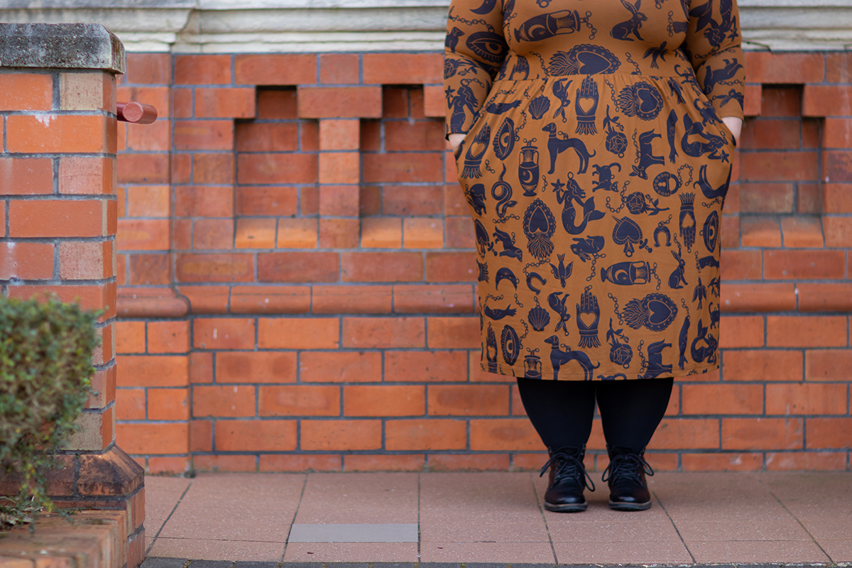 New Zealand plus size fashion blogger Meagan Kerr wears Made590 Sweeney Dress in Charmed, Snag Tights in black and Limited Edition Lecester Boots from Number One Shoes