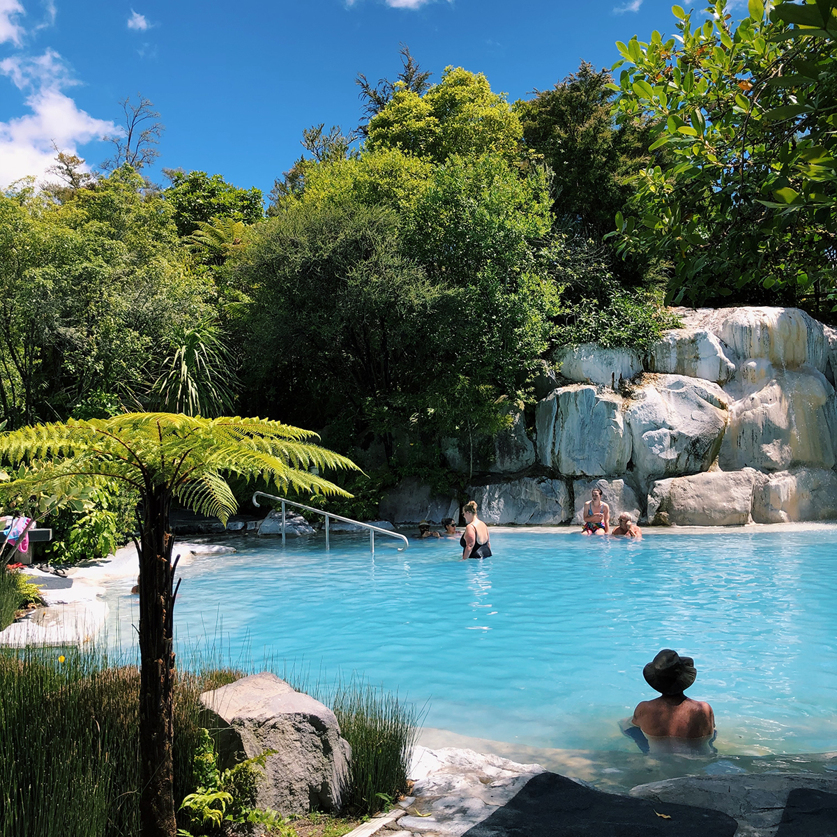 One of the thermal pools at Wairakei Terraces, with a waterfall.