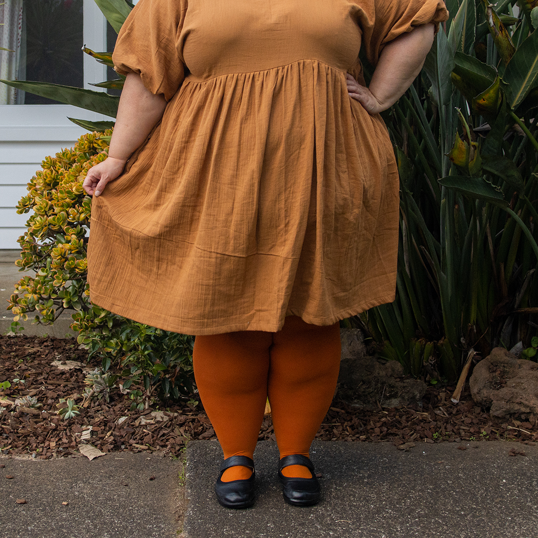 New Zealand plus size fashion blogger Meagan Kerr wears Noelle Dress in Bark, made by Sloan with Snag Tights in Toffee Apple and Abby Mary-Janes from Ziera