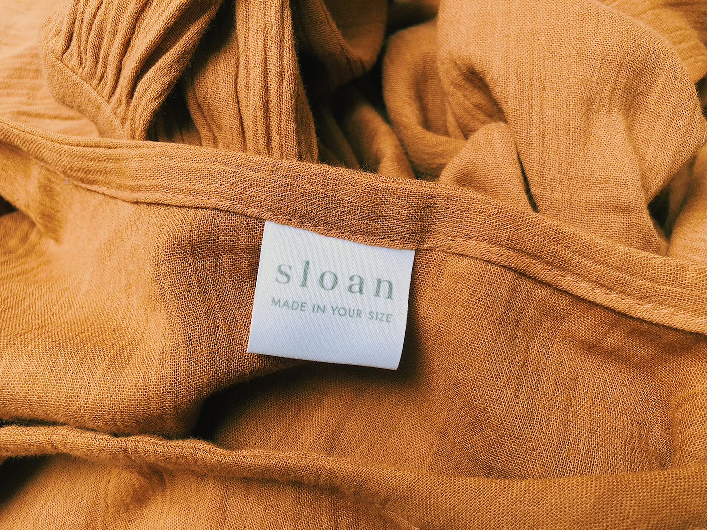 The label on my dress says: Sloan, made in your size