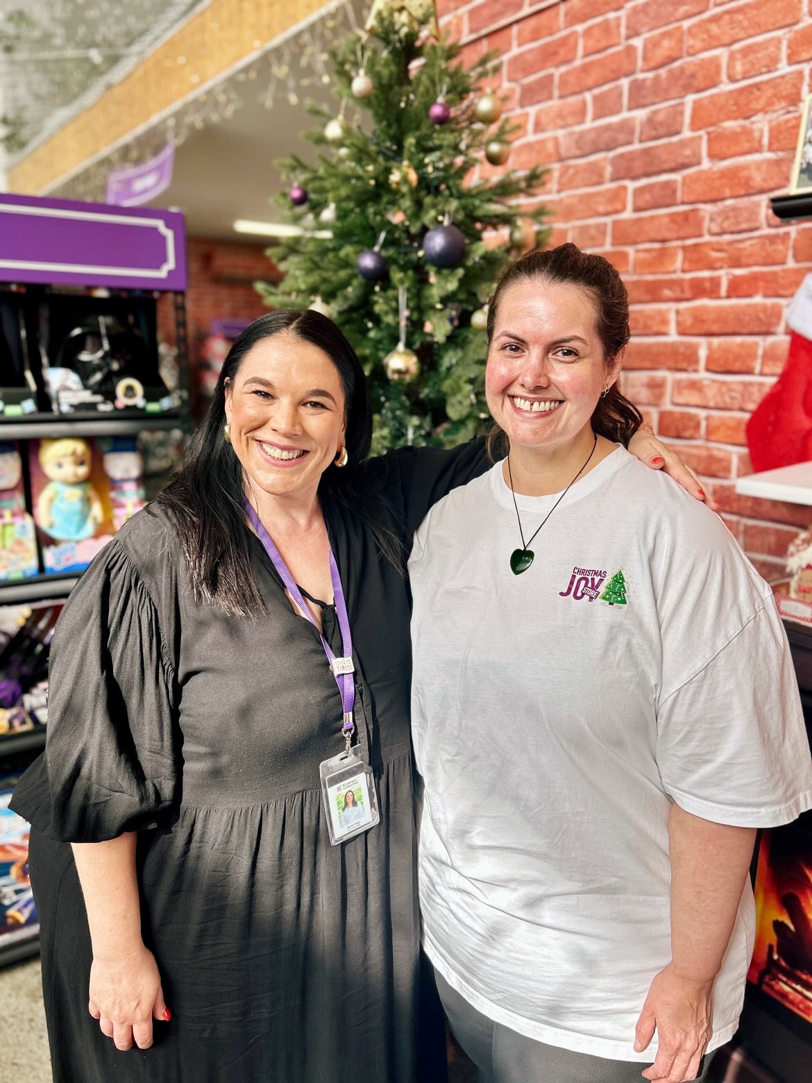 Two women, smiling at the camera.