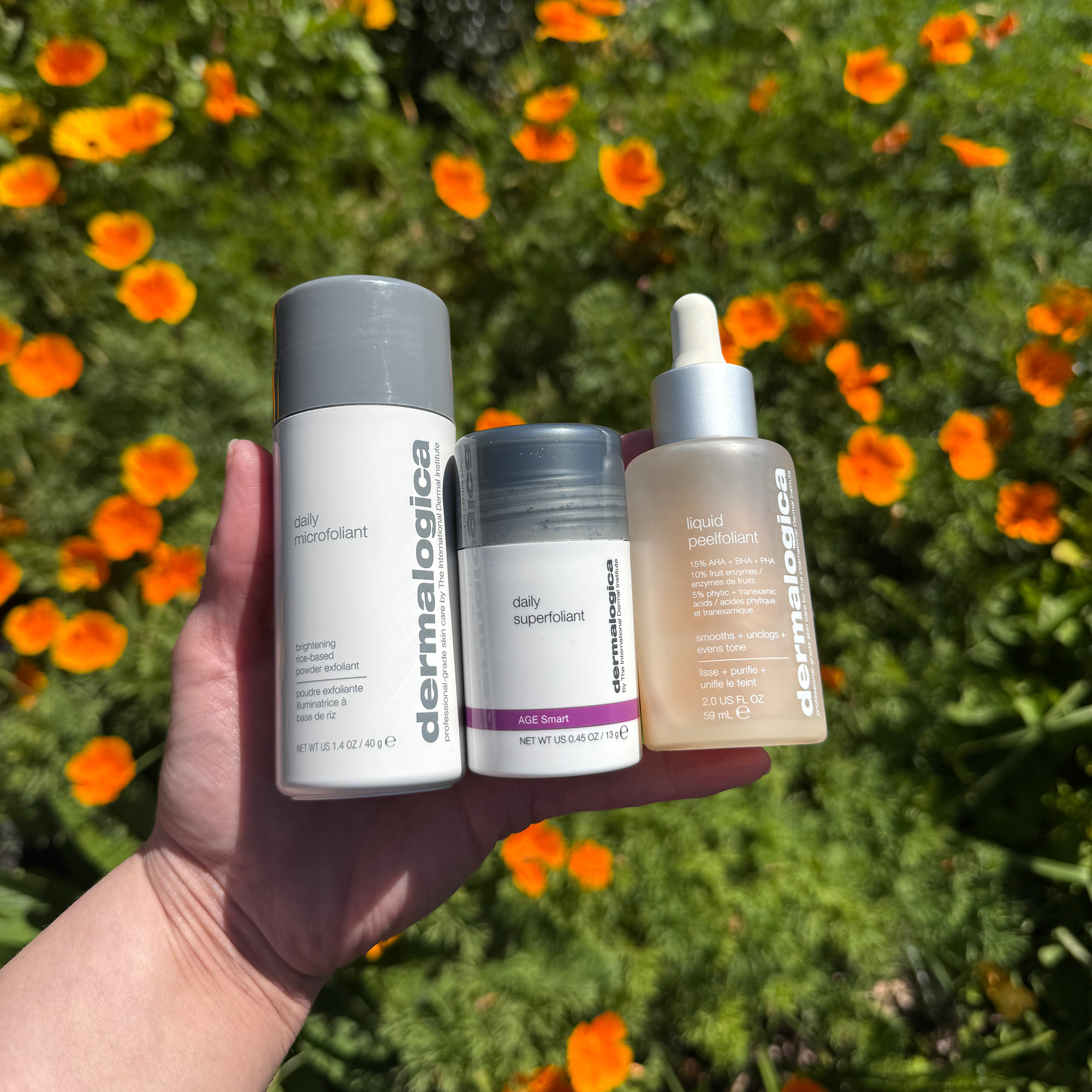 Meagan's hand holding some of her favourite exfoliating Dermalogica products